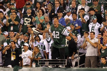 EAST RUTHERFORD, NJ - SEPTEMBER 13:  New York Jets fan fireman Ed Anzalone cheers for the New York Jets during their home opener against the Baltimore Ravens at the New Meadowlands Stadium on September 13, 2010 in East Rutherford, New Jersey.  (Photo by J