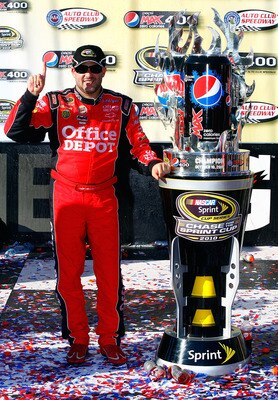 FONTANA, CA - OCTOBER 10:  Tony Stewart, driver of the #14 Office Depot Chevrolet, celebrates in victory lane after winning the NASCAR Sprint Cup Series Pepsi Max 400 on October 10, 2010 in Fontana, California.  (Photo by Jason Smith/Getty Images for NASC