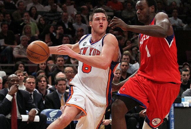 NEW YORK - MARCH 19: Danilo Gallinari #8 of the New York Knicks charges past Samuel Dalembert #1 of the Philadelphia 76ers at Madison Square Garden on March 19, 2010 in New York City. NOTE TO USER: User expressly acknowledges and agrees that, by downloadi
