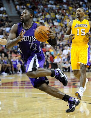 LAS VEGAS - OCTOBER 13:  Tyreke Evans #13 of the Sacramento Kings drives ahead of Ron Artest #15 of the Los Angeles Lakers during their preseason game at the Thomas & Mack Center October 13, 2010 in Las Vegas, Nevada. The Lakers won 98-95. NOTE TO USER: U