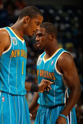 NEW ORLEANS - OCTOBER 13:  Trevor Ariza #1 and Chris Paul #3 of the New Orleans Hornets in action during the game against the Miami Heat at the New Orleans Arena on October 13, 2010 in New Orleans, Louisiana.  NOTE TO USER: User expressly acknowledges and