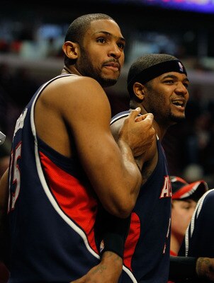 CHICAGO - MARCH 01: Al Horford #15 and Josh Smith #5 of the Atlanta Hawks react during the final minute of a win over the Chicago Bulls at the United Center on March 1, 2010 in Chicago, Illinois. The Hawks defeated the Bulls 116-92. NOTE TO USER: User exp