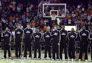 PHOENIX - OCTOBER 12:  The Utah Jazz stand attended for the National Anthem before the preseason NBA game against the Phoenix Suns at US Airways Center on October 12, 2010 in Phoenix, Arizona. NOTE TO USER: User expressly acknowledges and agrees that, by