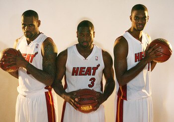MIAMI - SEPTEMBER 27:  (L-R) LeBron James, Dwyane Wade and Chris Bosh of the Miami Heat pose for photos during media day at the Bank United Center on September 27, 2010 in Miami, Florida.  (Photo by Marc Serota/Getty Images)