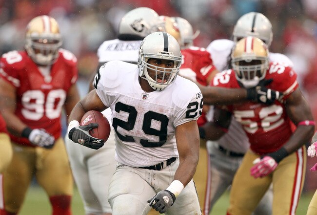 SAN FRANCISCO - OCTOBER 17:  Micahel Bush #29 of the Oakland Raiders runs with the ball against the San Francisco 49ers at Candlestick Park on October 17, 2010 in San Francisco, California.  (Photo by Ezra Shaw/Getty Images)