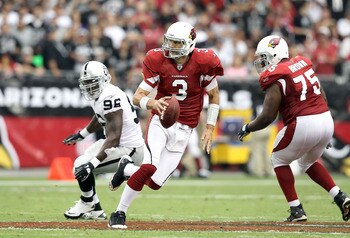 GLENDALE, AZ - SEPTEMBER 26:  Quarterback Derek Anderson #3 of the Arizona Cardinals scrambles with the football during the NFL game against the Oakland Raiders at the University of Phoenix Stadium on September 26, 2010 in Glendale, Arizona.  The Cardinal