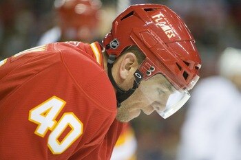 EDMONTON, CANADA - OCTOBER 16:  Calgary Flames left wing Alex Tanguay #40 takes a breather during a stoppage against the Edmonton Oilers at the Scotiabank Saddledome  on October 16, 2010 in Calgary, Alberta, Canada.  The Flames beat the Oilers 5-3.  (Phot