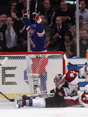 NEW YORK - OCTOBER 18: Alex Frolov #31 of the New York Rangers celebrates his first goal of the season at 18:09 of the first period against Craig Anderson #41 of the Colorado Avalanche at Madison Square Garden on October 18, 2010 in New York City.  (Photo