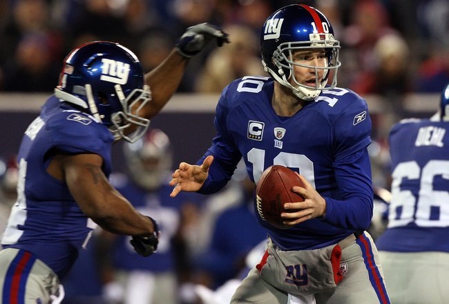 EAST RUTHERFORD, NJ - DECEMBER 06:  Eli Manning #10 of the New York Giants looks to throw a pass against the Dallas Cowboys on December 6, 2009 at Giants Stadium in East Rutherford, New Jersey. The Giants defeated the Cowboys 31-24.  (Photo by Jim McIsaac