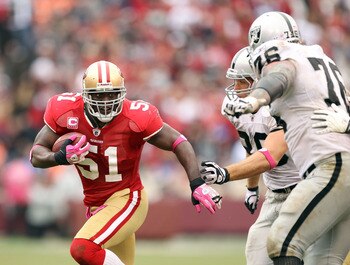 SAN FRANCISCO - OCTOBER 17:  Takeo Spikes #51 of the San Francisco 49ers returns an interception during their game against the Oakland Raiders at Candlestick Park on October 17, 2010 in San Francisco, California.  (Photo by Ezra Shaw/Getty Images)