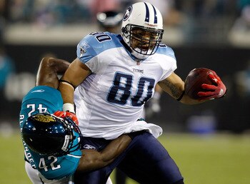 JACKSONVILLE, FL - OCTOBER 18:  Safety Gerald Alexander #42 of the Jacksonville Jaguars tries to stop tight end Bo Scaife #80 of the Tennessee Titans during the game at EverBank Field on October 18, 2010 in Jacksonville, Florida.  (Photo by J. Meric/Getty
