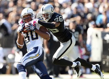 OAKLAND, CA - OCTOBER 10:  Malcom Floyd #80 of the San Diego Chargers catches a ball while defended by Stanford Routt #26 of the Oakland Raiders at Oakland-Alameda County Coliseum on October 10, 2010 in Oakland, California.  (Photo by Ezra Shaw/Getty Imag