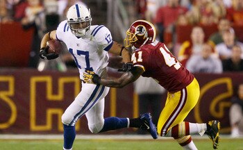 LANDOVER, MD - OCTOBER 17: Austin Collie #17 of the Indianapolis Colts moves the ball upfield after making a reception against Kareem Moore #41 of the Washington Redskins at FedExField on October 17, 2010 in Landover, Maryland.  (Photo by Win McNamee/Gett