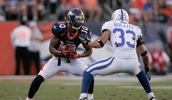 DENVER - SEPTEMBER 26:  Wide receiver Jabar Gaffney #10 of the Denver Broncos looks for extra yardage after making a catch in front of safety Melvin Bullitt #33 of the Indianapolis Colts during NFL action at INVESCO Field at Mile High on September 26, 201