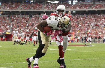 GLENDALE, AZ - OCTOBER 10:  Wide receiver Marques Colston #12 of the New Orleans Saints is tackled by Dominique Rodgers-Cromartie #29 of the Arizona Cardinals after a reception during the first quarter of the NFL game at the University of Phoenix Stadium
