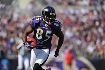 BALTIMORE, MD - OCTOBER 10: Derrick Mason #85 of the Baltimore Ravens runs the ball against the Denver Broncos at M&T Bank Stadium on October 10, 2010 in Baltimore, Maryland. Players wore pink in recognition of Breast Cancer Awareness Month. The Ravens de
