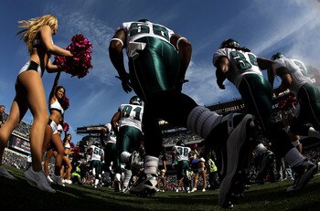 PHILADELPHIA - OCTOBER 17:  A Philadelphia Eagles cheerleader greets the Eagles as they take the field against the Atlanta Falcons during their game at Lincoln Financial Field on October 17, 2010 in Philadelphia, Pennsylvania.  (Photo by Al Bello/Getty Im