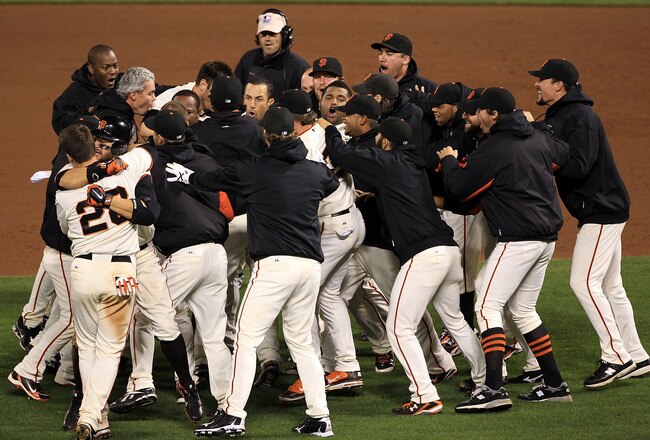 SAN FRANCISCO - OCTOBER 20:  The San Francisco Giants celebrate after a sacrifice fly by Juan Uribe #5 scored Aubrey Huff #17 to win 6-5 over the Philadelphia Phillies in Game Four of the NLCS during the 2010 MLB Playoffs at AT&T Park on October 20, 2010