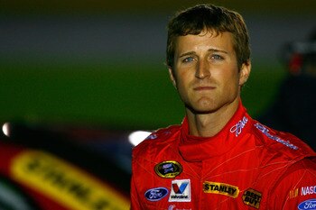 CONCORD, NC - OCTOBER 14:  Kasey Kahne, driver of the #9 Budweiser Ford, stands on the grid during qualifying for the NASCAR Sprint Cup Series Bank of America 500 at Charlotte Motor Speedway on October 14, 2010 in Concord, North Carolina.  (Photo by Jason