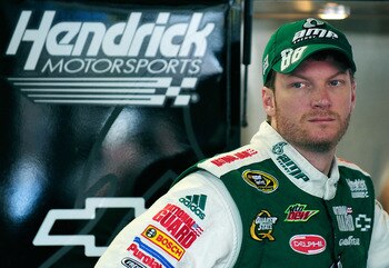 CONCORD, NC - OCTOBER 14:  Dale Earnhardt Jr., driver of the #88 AMP Energy/National Guard Chevrolet, stands in the garage during practice for the NASCAR Sprint Cup Series Bank of America 500 at Charlotte Motor Speedway on October 14, 2010 in Concord, Nor