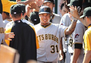 CINCINNATI - SEPTEMBER 12:  Jose Tabata #31 of the Pittsburgh Pirates is congratulated by teammates after scoring one of the three ninth inning runs during the game against the Cincinnati Reds at Great American Ballpark on September 12, 2010 in Cincinnati