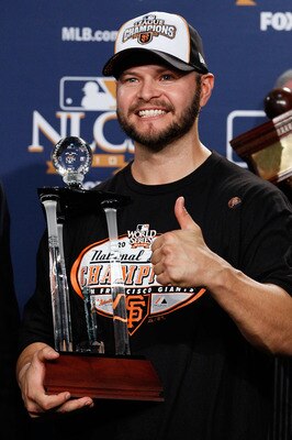 PHILADELPHIA - OCTOBER 23:  Cody Ross #13 of the San Francisco Giants celebrates with the NCLS MVP trophy after defeating the Philadelphia Phillies 3-2 and winning the pennant in Game Six of the NLCS during the 2010 MLB Playoffs at Citizens Bank Park on O