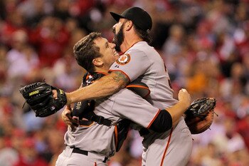 PHILADELPHIA - OCTOBER 23:  Buster Posey #28 and Brian Wilson #38 of the San Francisco Giants celebrate defeating the Philadelphia Phillies 3-2 and winning the pennant in Game Six of the NLCS during the 2010 MLB Playoffs at Citizens Bank Park on October 2