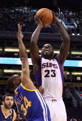 PHOENIX - OCTOBER 19:  Jason Richardson #23 of the Phoenix Suns attempts a shot over Charlie Bell #34 of the Golden State Warriors during the preseason NBA game at US Airways Center on October 19, 2010 in Phoenix, Arizona. NOTE TO USER: User expressly ack