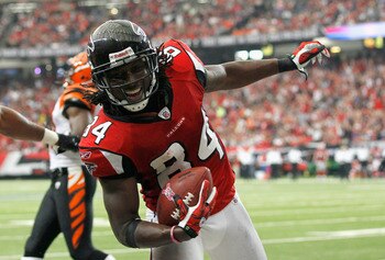 ATLANTA - OCTOBER 24:  Roddy White #84 of the Atlanta Falcons scores a touchdown against the Cincinnati Bengals at Georgia Dome on October 24, 2010 in Atlanta, Georgia.  (Photo by Kevin C. Cox/Getty Images)