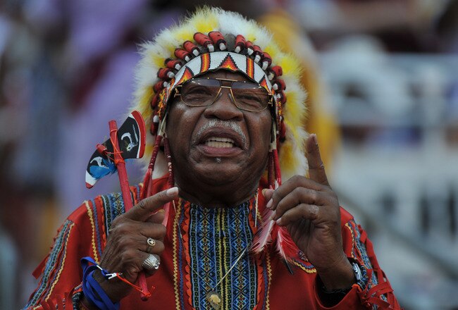 LANDOVER - SEPTEMBER 19:  A fan of the Washington Redskins cheers against the Houston Texans at FedExField on September 19, 2010 in Landover, Maryland. The Texans defeated the Redskins in overtime 30-27. (Photo by Larry French/Getty Images)