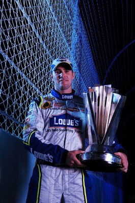 HOMESTEAD, FL - NOVEMBER 18:  Jimmie Johnson, driver of the #48 Lowe's Chevrolet, poses with the Nextel Cup Trophy after winning the NASCAR Nextel Cup Series at Homestead-Miami Speedway on November 18, 2007 in Homestead, Florida.  (Photo by Marc Serota/Ge