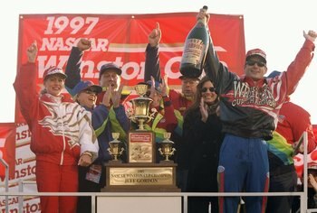 16 Nov 1997: Jeff Gordon celebrates winning the NASCAR Championship after the NAPA 500 at the Atlanta Motor Speedway in Hampton, Georgia.