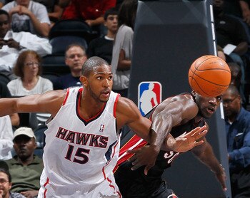 ATLANTA - OCTOBER 21:  Al Horford #15 of the Atlanta Hawks battles for a rebound against Joel Anthony #50 of the Miami Heat at Philips Arena on October 21, 2010 in Atlanta, Georgia.  (Photo by Kevin C. Cox/Getty Images)