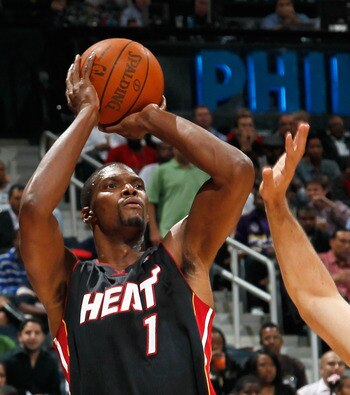 ATLANTA - OCTOBER 21:  Chris Bosh #1 of the Miami Heat shoots over Zaza Pachulia #27 of the Atlanta Hawks at Philips Arena on October 21, 2010 in Atlanta, Georgia.  (Photo by Kevin C. Cox/Getty Images)