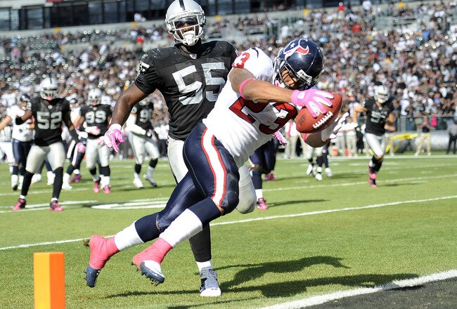 OAKLAND, CA - OCTOBER 3:  Running back Arian Foster #23 of the Houston Texans scores a touchdown in front of linebacker Rolando McClain #55 of the Oakland Raiders  during an NFL football game October 3, 2010 at The Oakland-Alameda County Coliseum in Oakla