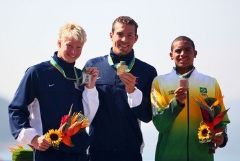 RIO DE JANEIRO, BRAZIL - JULY 14:  (L-R) Charles Peterson of the USA with Silver, Fran Crippen of the USA with Gold and Allan Carmo of Brazil with Bronze on the podium during the Men's Swimming Marathon 10km Final, part of the XV Pan American Games on Jul
