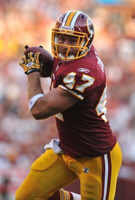 LANDOVER - SEPTEMBER 19:  Chris Cooley #47 of the Washington Redskins runs the ball in for a touchdown against the Houston Texans at FedExField on September 19, 2010 in Landover, Maryland. The Texans defeated the Redskins 30-27 in overtime. (Photo by Larr