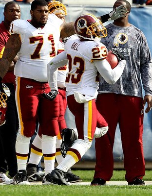 CHICAGO - OCTOBER 24: Trent Williams #71 of the Washington Redskins points to the end zone as teammate DeAngelo Hall #23 takes an interception in for a touchdown against the Chicago Bears at Soldier Field on October 24, 2010 in Chicago, Illinois. The Reds