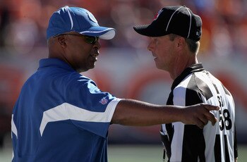 DENVER - SEPTEMBER 26:  Head coach Jim Caldwell of the Indianapolis Colts questions a call with side judge Jimmy DeBell as the Colts face the Denver Broncos at INVESCO Field at Mile High on September 26, 2010 in Denver, Colorado.  (Photo by Doug Pensinger