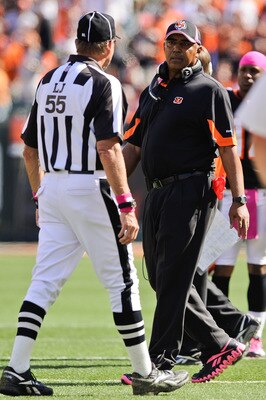 CINCINNATI, OH - OCTOBER 10: Head Coach Marvin Lewis of the Cincinnati Bengals talks with Line Judge Tom Barnes #55 during a game against the Tampa Bay Buccaneers at Paul Brown Stadium on October 10, 2010 in Cincinnati, Ohio. (Photo by Jamie Sabau/Getty I