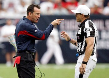 HOUSTON - SEPTEMBER 12:  Houston Texans head coach Gary Kubiak has words with referee Ed Hochuli after the Texans were charged with a timeout after the play clock was zero against the indianapolis Colts during the NFL season opener at Reliant Stadium on S