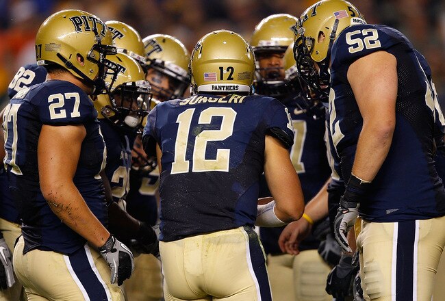 PITTSBURGH - SEPTEMBER 23:  Tino Sunseri #12 of the Pittsburgh Panthers calls a play in the huddle during the game against the Miami Hurricanes on September 23, 2010 at Heinz Field in Pittsburgh, Pennsylvania.  (Photo by Jared Wickerham/Getty Images)