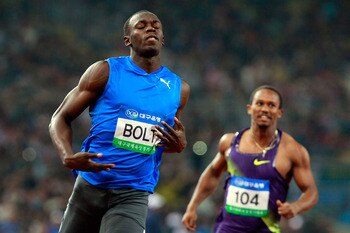 DAEGU, SOUTH KOREA - MAY 19:  Usain Bolt of Jamaica celebrates after crossing the finish line of the men's 100 metres during the Colorful Daegu Pre-Championships Meeting 2010 at Daegu Stadium on May 19, 2010 in Daegu, South Korea. Bolt won the race at 9.8