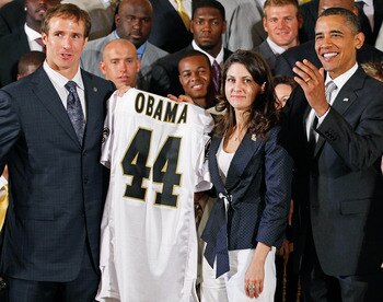 WASHINGTON - AUGUST 09:  U.S. President Barack Obama (R) poses for photograph with New Orleans Saints quarterback Drew Brees (L) and team owner and Executive Vice President Rita Benson LeBlanc during a reception for the 2010 National Football League Super