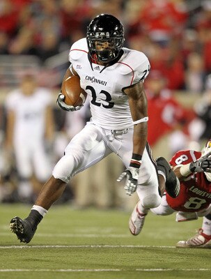 LOUISVILLE, KY - OCTOBER 15: Isaiah Pead #23 of the Cincinnati Bearcats runs with the ball during the Big East Conference game against the Louisville Cardinals at Papa John's Cardinal Stadium on October 15, 2010 in Louisville, Kentucky.  (Photo by Andy Ly