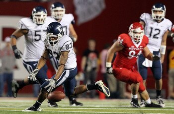 PISCATAWAY, NJ - OCTOBER 08:  Kashif Moore #82 of the Connecticut Huskies drops a pass late in the game against the Rutgers Scarlet Knights at Rutgers Stadium on October 8, 2010 in Piscataway, New Jersey. Rutgers defeated UConn 27-24.  (Photo by Jim McIsa