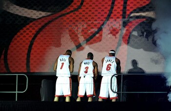MIAMI - JULY 09:  Chris Bosh #1, Dwyane Wade #3, and LeBron James #6 of the Miami Heat are introduced to fans during a welcome party at American Airlines Arena on July 9, 2010 in Miami, Florida.  (Photo by Doug Benc/Getty Images)