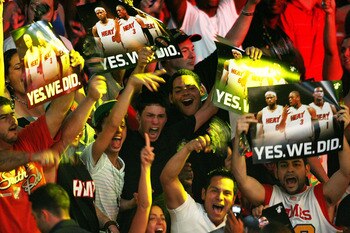MIAMI - JULY 09:  Fans cheer as Chris Bosh #1, Dwyane Wade #3, and LeBron James #6 of the Miami Heat are introduced during a welcome party at American Airlines Arena on July 9, 2010 in Miami, Florida.  (Photo by Marc Serota/Getty Images)