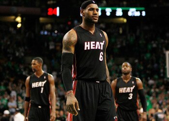 BOSTON, MA - OCTOBER 26: LeBron James #6, Chris Bosh #1 and Dwyane Wade #3 of the Miami Heat walk into position moments before losing to the Boston Celtics, 88-80, at the TD Banknorth Garden on October 26, 2010 in Boston, Massachusetts. NOTE TO USER: User