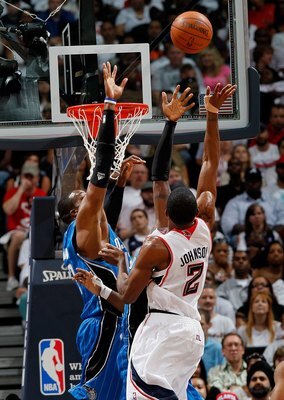 ATLANTA - MAY 08:  Dwight Howard #12 of the Orlando Magic and Joe Johnson #2 of the Atlanta Hawks during Game Three of the Eastern Conference Semifinals during the 2010 NBA Playoffs at Philips Arena on May 8, 2010 in Atlanta, Georgia.  NOTE TO USER: User 